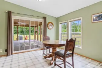 Dining area off of kitchen, so light & bright.