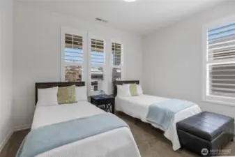 2nd bedroom privately located at the far-end of the home (away from the owner's suite) has generous space, large closet and main view of the precious front porch (not the neighbor's house).