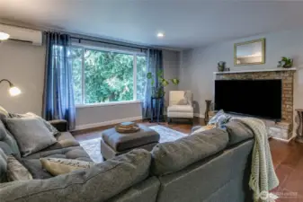 Large living room w/ modern windows and LPV flooring