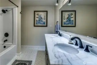 Guest bath w/ double sinks and brand new tub/shower enclosure