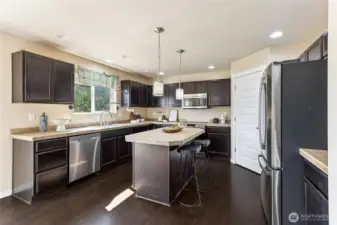 Large kitchen with island and includes all appliances.