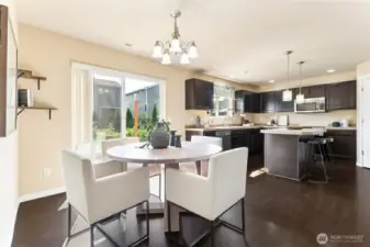 kitchen flows to  a spacious dining area, includes plenty of natural light