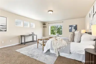 Large and bright primary suite with 5 pc bath and walk in closet.