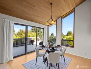 An informal dining space is just on the other side with access to the enormous back deck.