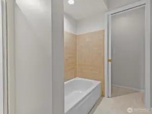 An oversized double vanity leads you into the bathroom with separate tub and shower with water closet for additional privacy.