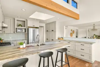 There is plenty of counter space and lots of storage in the kitchen. The hand-selected quartz countertops are a reflection of the beach and ocean waves