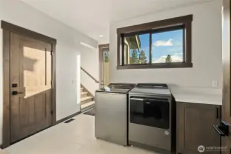 Laundry and mud room with exterior door and garage access