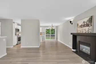 Adjacent to the kitchen, this dining area opens directly to the back deck—ideal for indoor-outdoor entertaining.