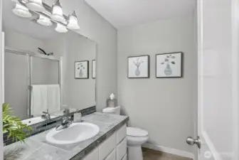 Beautifully updated full bath featuring modern fixtures, fresh finishes, and a clean, timeless design.