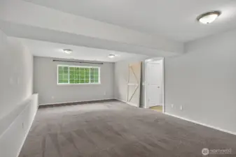 Huge downstairs living area with plenty of room to spread out, featuring flexible space for entertaining or relaxing.