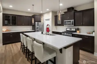 Beautiful modern kitchen with gas cooktop, open concept for easy entertaining.