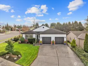 Front exterior view showing corner-lot placement.