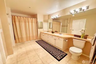 Primary bath with tile surround floor & counter, elegant 5-pc + additional separate shower!