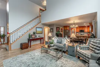 Living room flows into kitchen with dining area