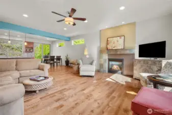 Light filled open living space offers easy flow and a natural connection to the surrounding greenery.