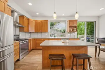 Central island anchors the kitchen, offering generous workspace and a natural place for casual seating and conversation.