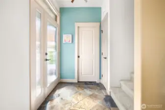 Welcoming entry with natural light and a direct connection into the home.