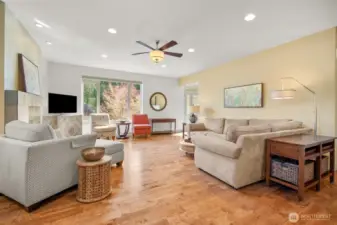 Comfortable living space centered around the fireplace with views to the outdoors.