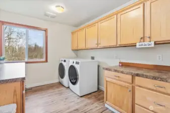 Located upstairs. Love this laundry room! Tons of storage