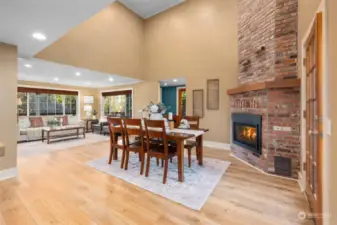 The dining area has a gas fireplace, perfect to take the chill off.    The LVP floors are new and a perfect match to the Craftsman styling of the home.