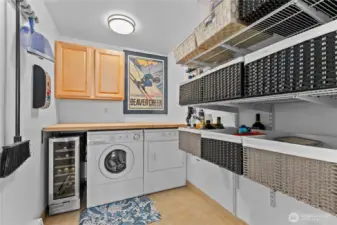 Off-kitchen laundry room with wine fridge
