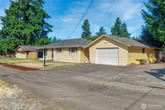 Two detached Garages with RV parking and more!