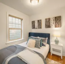 Efficient bedroom accommodates a queen bed.