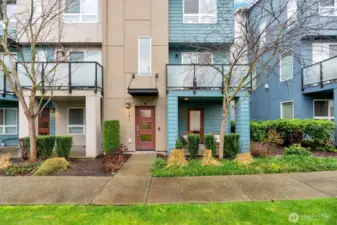 Inviting entry with a separate patio off main level suite/office.
