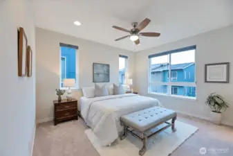 Peaceful, quiet and spacious primary suite with stylish ceiling fan for year-round comfort