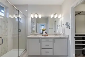 Well designed master bath with over-sized shower, double sink with plenty of storage with walk-in closet