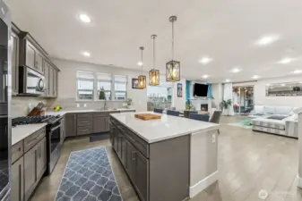 View from butler's pantry to kitchen, informal dining and great room