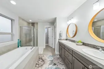 Primary bath with extra long tub, double sinks & large shower