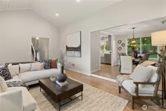 Living room is adjacent to the formal dining room.