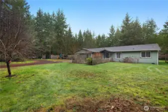 Charming 1,700 sq ft one-story home surrounded by mature landscaping.   Garden space | apple, cherry, pear and plum trees.