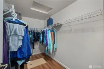 Spacious walk-in-closet in primary suite.