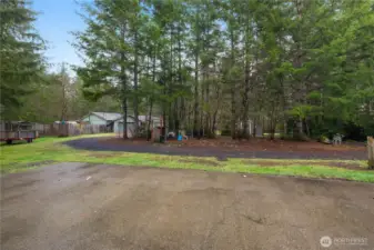 View from shop towards one-story home.