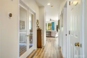 A guest bath and formal dining on the hallway