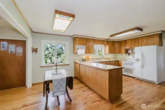 Hardwood floors in kitchen and breakfast nook.