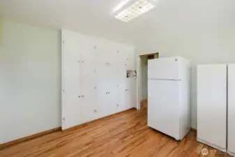 Lots of built-in cabinets in utility room.