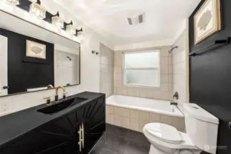 Upstairs bath with modern touches.