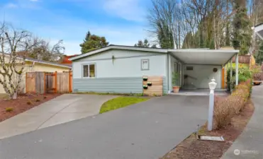 Front of home faces Southwest.  Attached 1 car carport plus 2 additional driveway parking spaces.