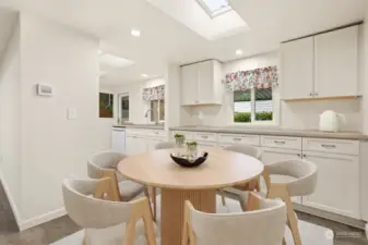 Formal dining room with built in cabinets and counters (match the kitchen), opens to living room.  Virtually staged photo.