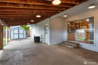 Huge Covered Patio Runs Length of West Side of Home