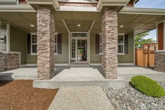 Enjoy greeting your guests on this stunning & inviting covered front porch.