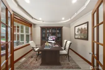 The double french doors lead to the spacious Study, overlooking the front of the Home. (Virtual staging).