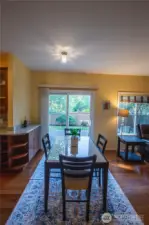The designer cabinets wrap around to the casual eating area to provide this unique beverage center.