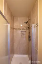 The updated and refreshed shower is in its own room with the toilet for privacy.