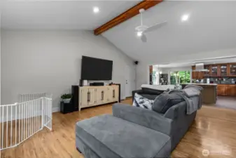 Open living with hardwood floors, vaulted ceilings and fresh interior paint