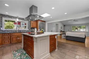 Chef's kitchen featuring custom cabinetry and a glorious granite slab island! High-end Miele, Subzero & Thermador appliances all stay