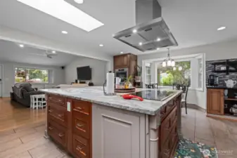 Chef's kitchen featuring custom cabinetry and a glorious granite slab island! High-end Miele, Subzero & Thermador appliances all stay